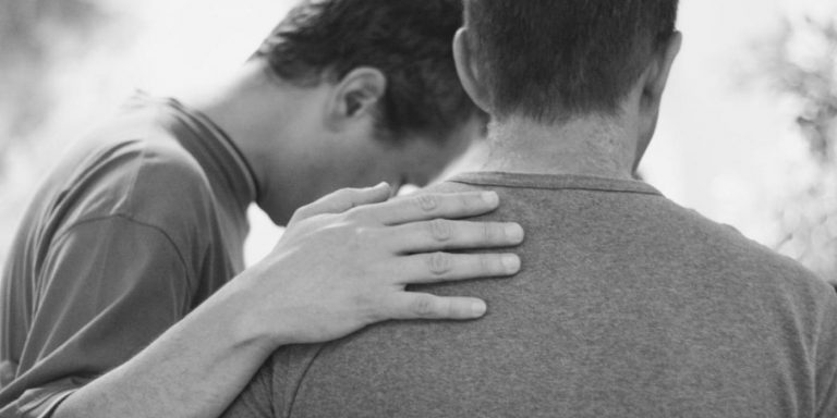 men praying gym