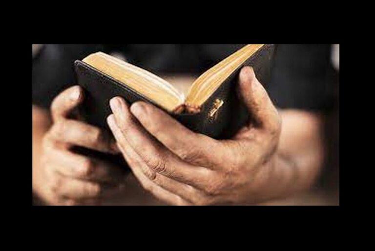 man hands bible